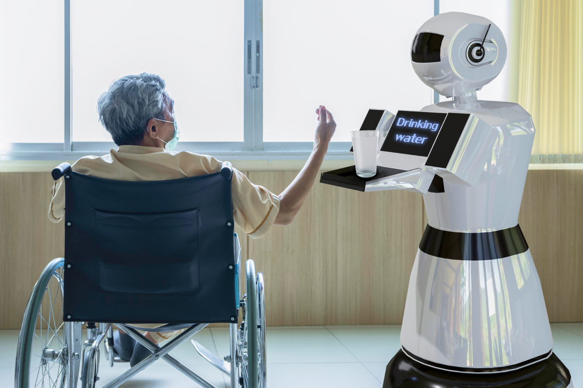 휠체어 탄 노인에게 물을 주는 휴머노이드 로봇 사진